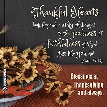 Free SarahJean Thanksgiving eCard with a Christian message entitled 'Thankful Hearts'. Image of mini sun flowers laying on a table.